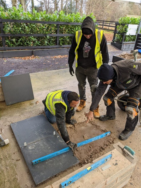 Business Development Manager Daniel Time learns landscaping skills on training day.