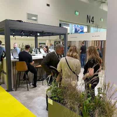 A busy stand at Futurescape 2022 with business development managers talking to visitors.