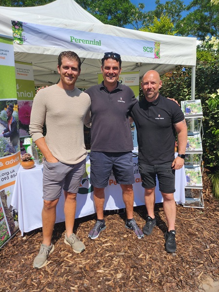 3 people standing in front of Perennial stand at Gardener's World Live 2023