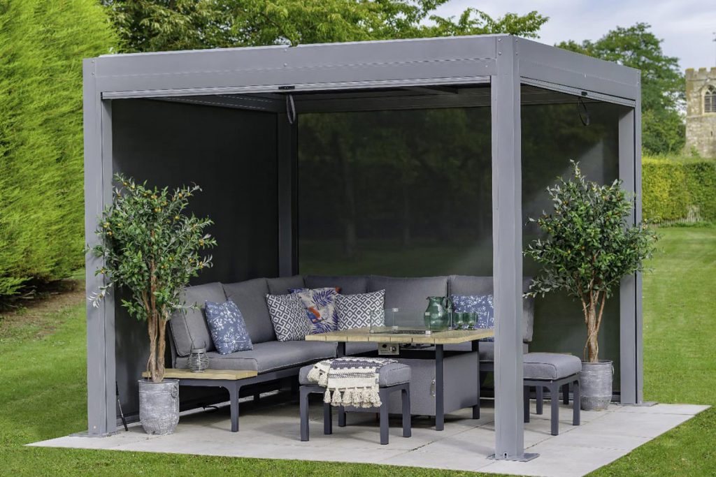 A free standing metal pergola with furniture underneath is the perfect place to enjoy your outside space. 