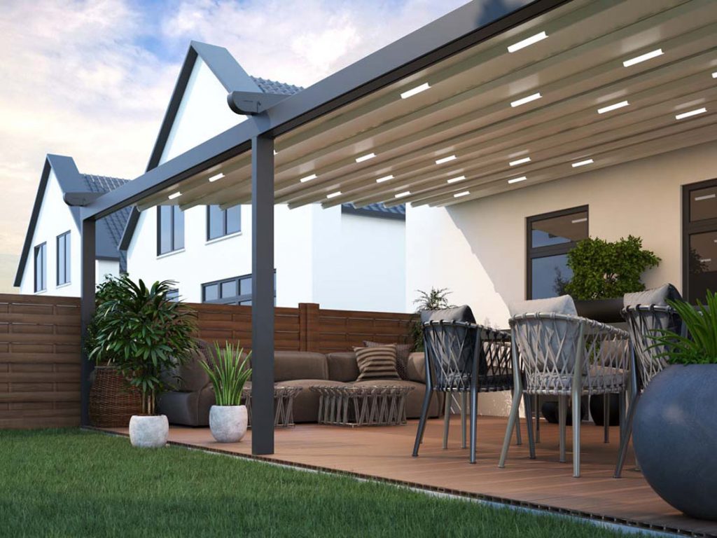 Our metal pergola is wall mounted to sit flush against the wall over a decked area with garden furniture.