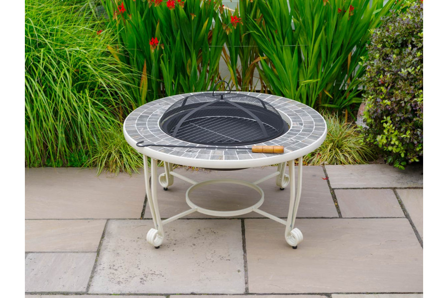 A charcoal fire pit is the perfect place to gather friends and family around and enjoy evenings in the garden.