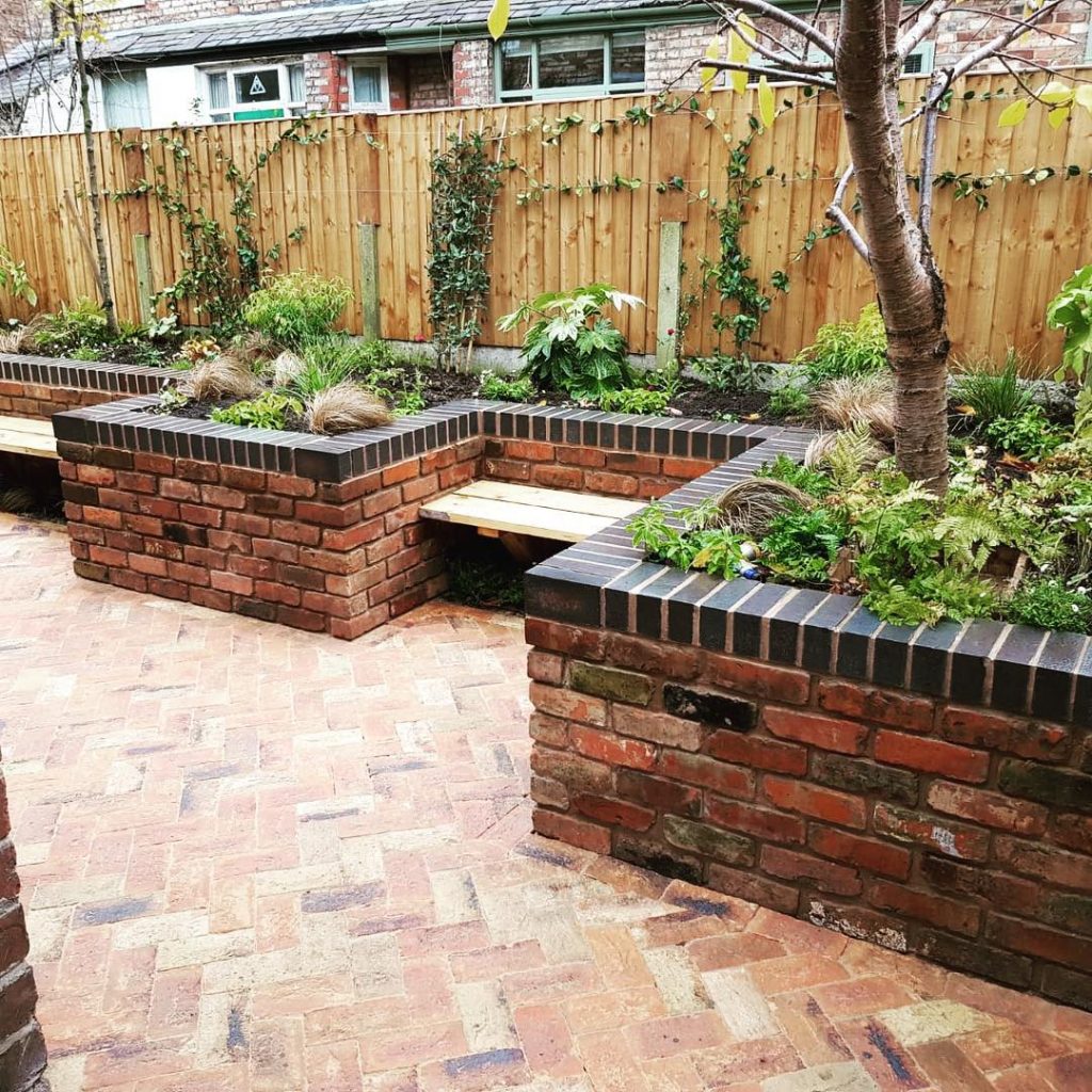 Facing bricks add a classic finish around the garden when matched with complementary paving. 