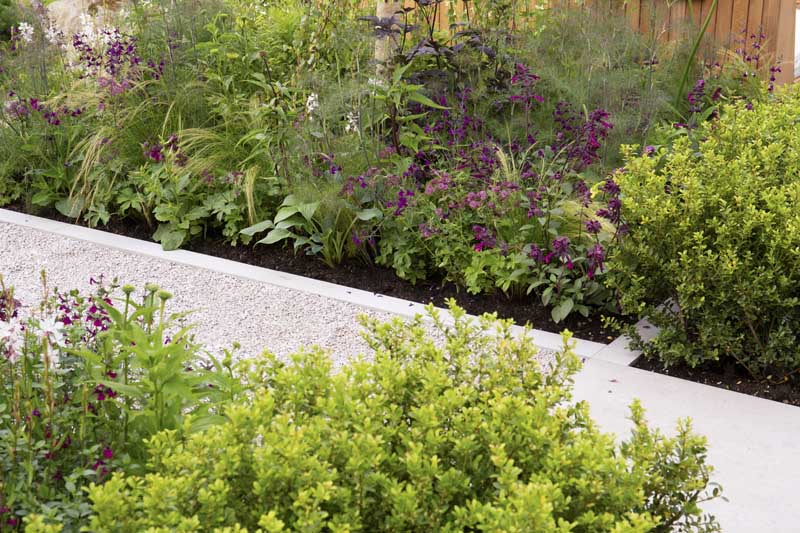 Viking Frilufsliv Garden by Will Williams, built by Burnham Landscapes, Hampton Court Palace Garden Festival 2021, Jura Grey Limestone paths with wildlife friendly planting.