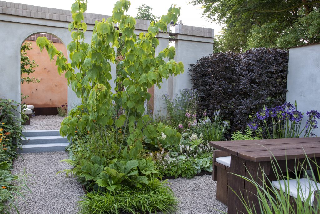 The Earth Garden is designed with nature in mind, so places a heavy emphasis on the planting. The jungle like feel is paired with hardscaping in the form of 100mm thick Grey Yorkstone step, walling and recycled garden furniture. 