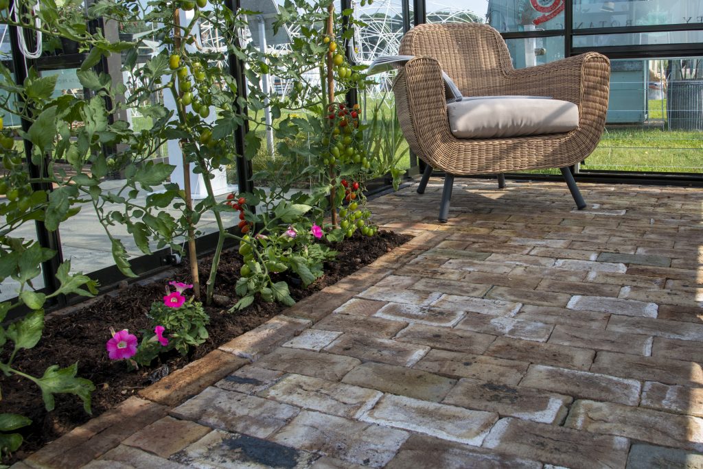 London Mixture clay pavers have a beautiful classic feel that looks right at home in the charming greenhouse filled with tomato plants. 