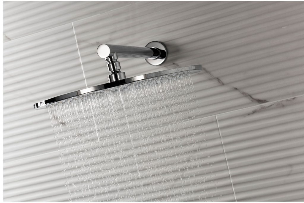 Our marble effect tiles are used behind this shower head.