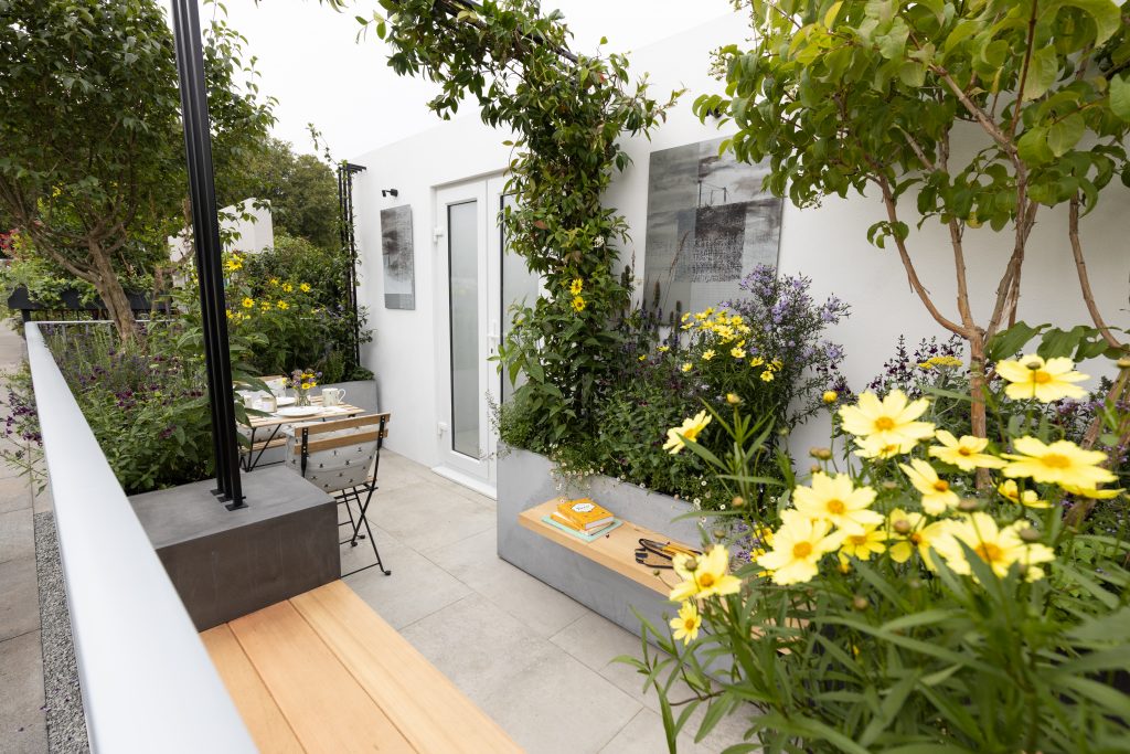 Making the most of small spaces this balcony garden uses Light Grey Porcelain to brighten the space. 