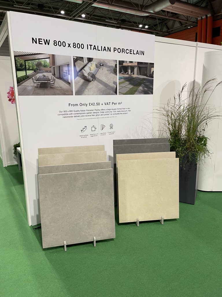 Large format 800x800 porcelain samples, with a fibreglass planter next to them.