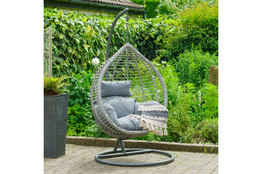 Salzburg Egg Chair with slate-grey, quick-drying cushions, on patio by planting.
