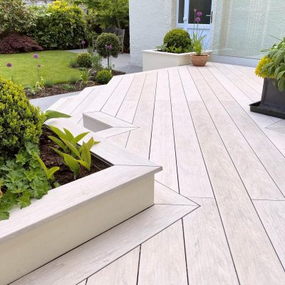 Expanse of decking showing how cutting composite decking precisely enhances a design. Mitred joints at corners.