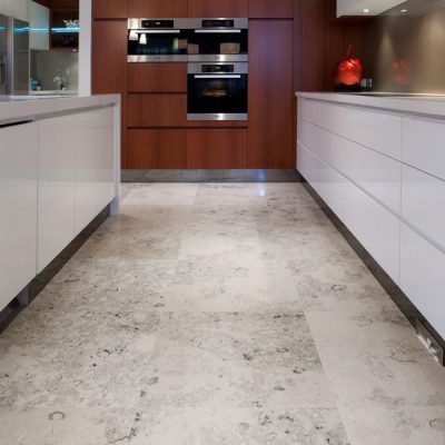 Jura Grey Honed Limestone Tiles are used for this kitchen flooring.