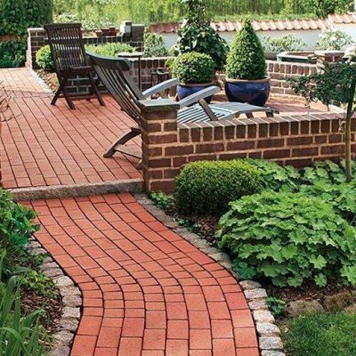 Our Delta Red Clay Pavers are used to create an impressive red brick pathway.
