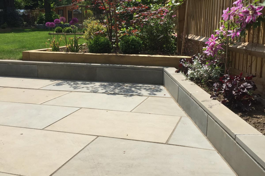 Heath Smooth Sandstone Paving in a stunning garden design by Landscape Artisan