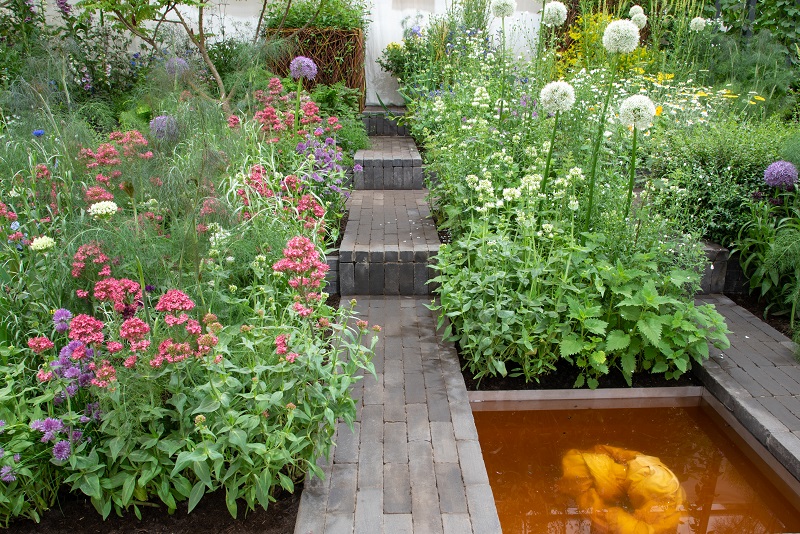 Charcoal Grey Dutch Clay Pavers rise via steps between beds on Textile Garden for Fashion Revolution, RHS Chelsea 2022