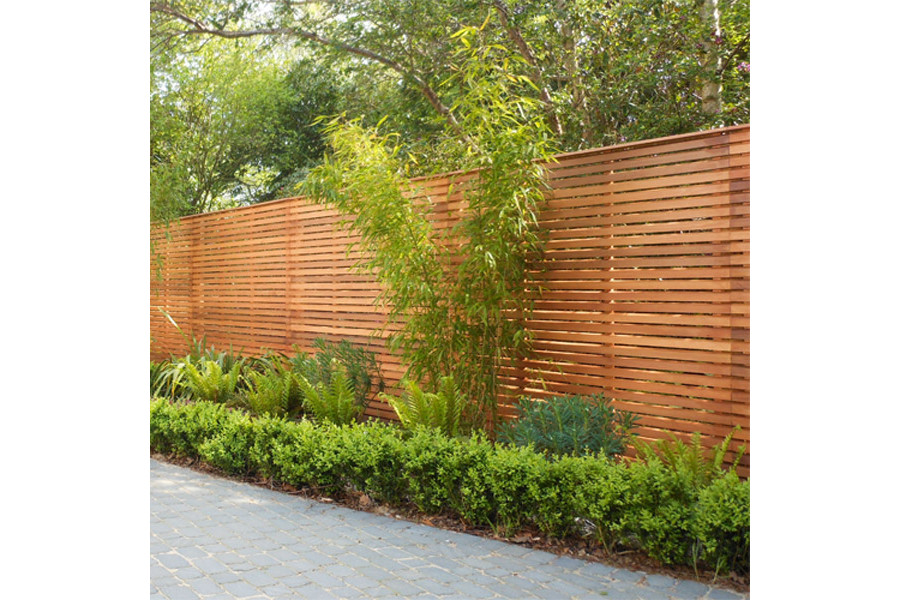 Our slatted bevel edged fence panels are cut with a 45-degree angle and made from cedar wood.