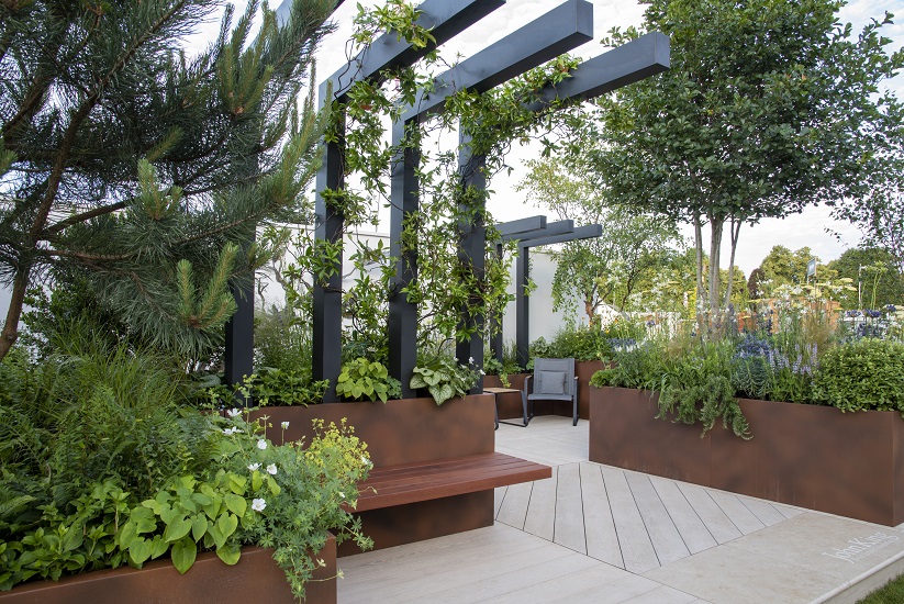 John King Tumour Foundation Garden, Hampton Court Palace Garden Festival, with Jura Beige Limestone and Limed Oak Millboard.