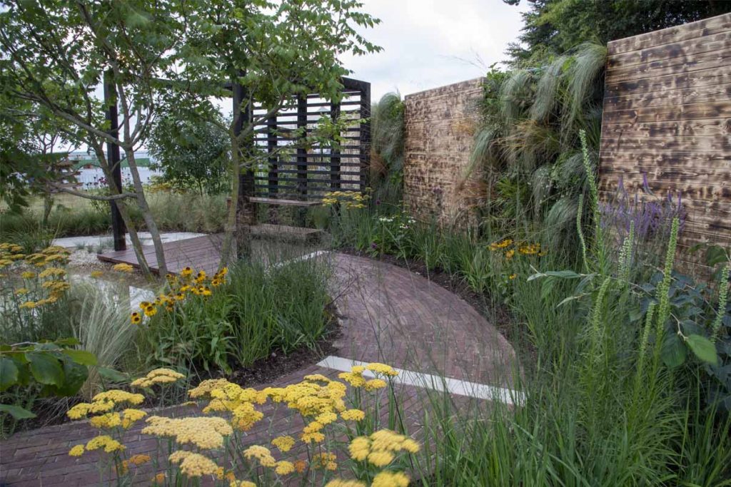 Curved path of Bexhill Clay Pavers in Slow Down, Breathe Deep by Alex Pettit at RHS Tatton Park Flower Show 2022.