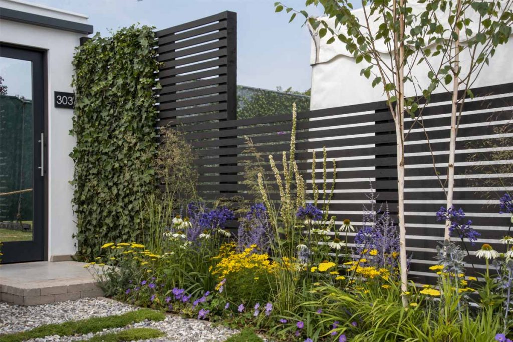 Dark Ash composite batten slatted fence in Cotton Traders Greener Future Garden, RHS Tatton Park 2022, by Lynn Cordall.