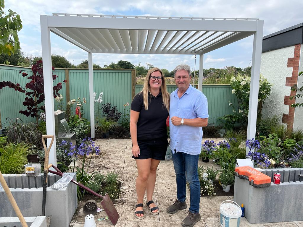 Jennie Palmer with Alan Titchmarsh in a Love Your Garden episode.