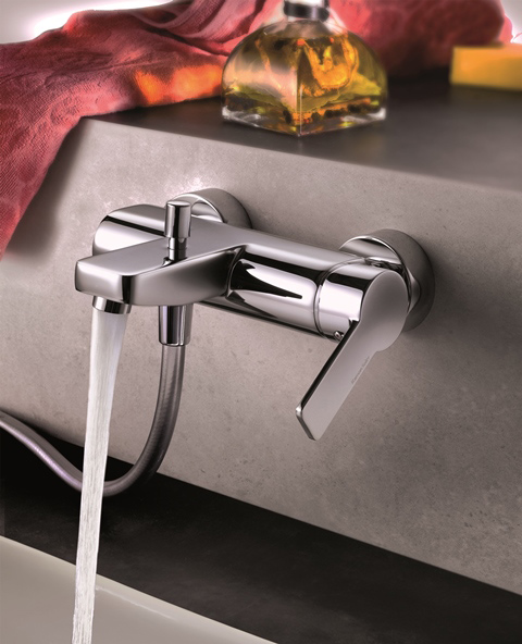 Chrome mixer tap set in Hydra Argen DesignClad batheroom cladding, water running.