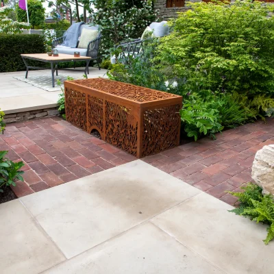 Britannia Buff Yorkstone with Dorset Antique clay pavers, corten steel benches and planting.