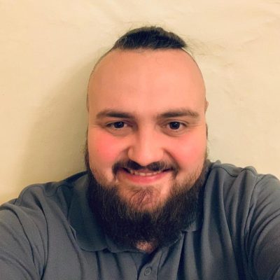 Man with beard and moustache smilling