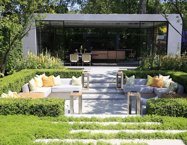 LG Eco-City Garden, RHS Chelsea 2018, with Jura Grey paving, sunken seating area, and large open-fronted studio.