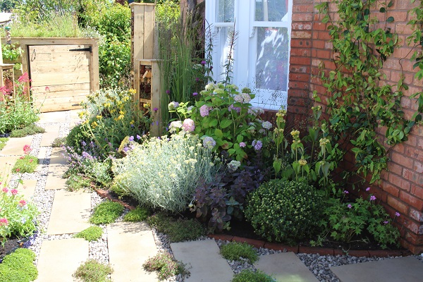 A period house front with planted bed and gravel and buff Yorkstone paving in the APL Avenue, BBC Gardeners' World Live.