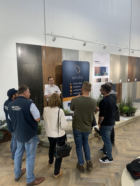 Small group stands in front of Viridis Plants presentation at Meet the Supplier event, Bristol showroom.