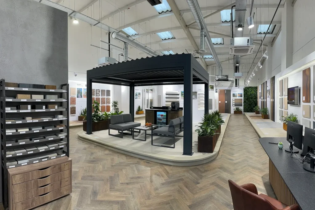 Interior of Manchester garden paving showroom with sample display, pergola, and wall mounted paving and cladding.