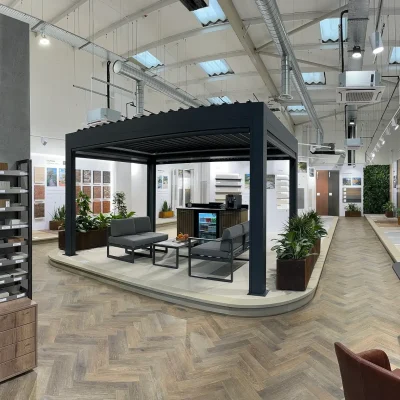 Interior of Manchester garden paving showroom with sample display, pergola, and wall mounted paving and cladding.
