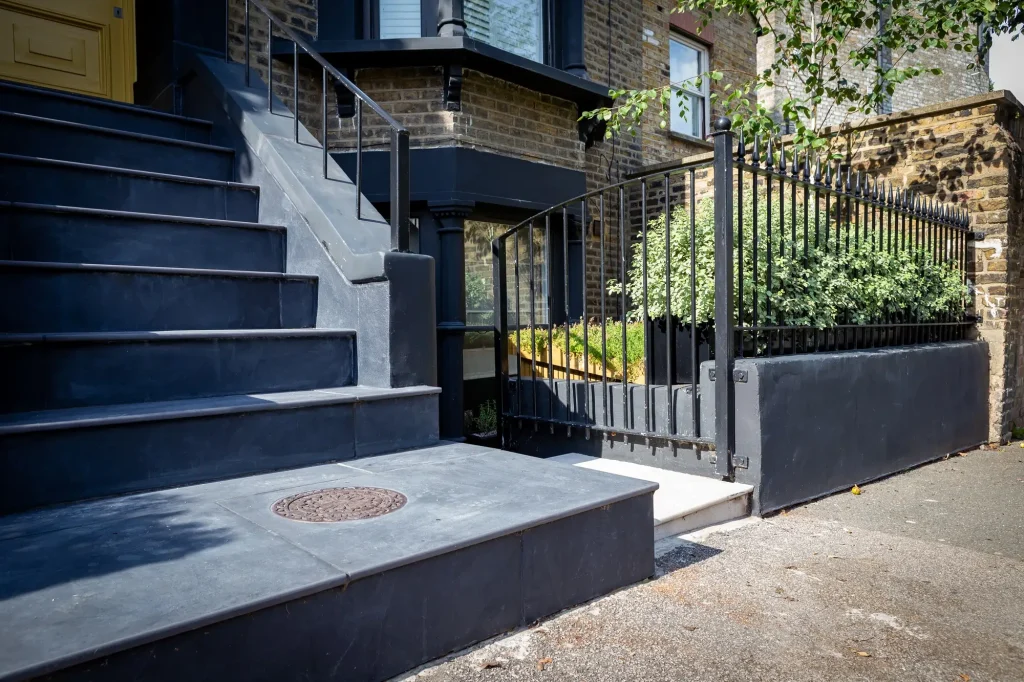 Steep steps from front door to pavement in Florence Dark with 20mm bullnose.