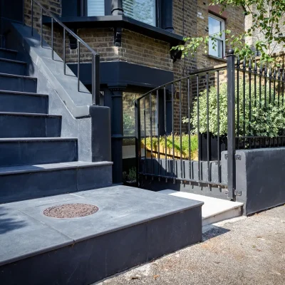 Steep steps from front door to pavement in Florence Dark with 20mm bullnose.
