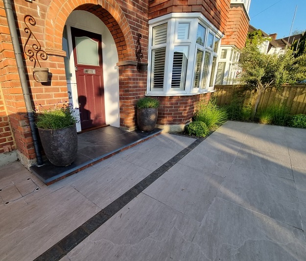 Front of 1930s suburban semi-detached house with Brazilian Slate step and Kandla Grey porcelain paving