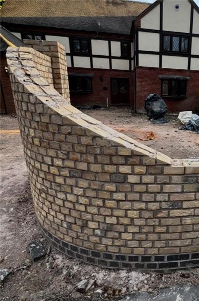 Curved brick wall with downward sweep not suitable for templating