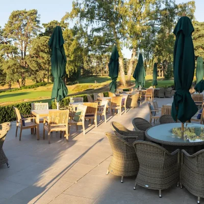 Golf club terrace in Egyptian Beige limestone with round dining tables