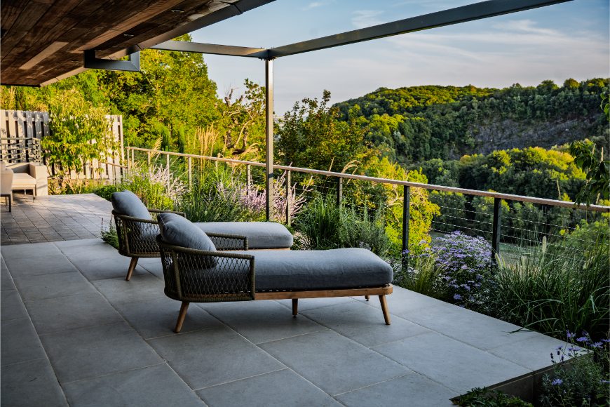 2 chaise longues on Florence Grey porcelain paving patio overlooking Avon Valley Gorge, Bristol. Landscape Artisan.