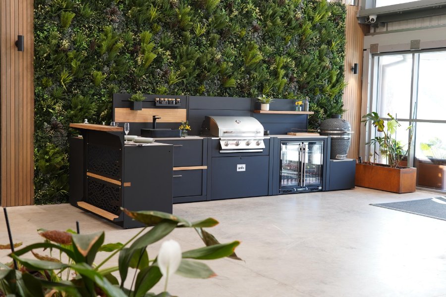 Grillo Outdoor kitchen in front of Vistafolia green wall at Birmingham showroom entrance 