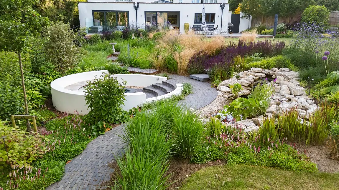 Sloping Garden Tamed with Curves and Clay Pavers