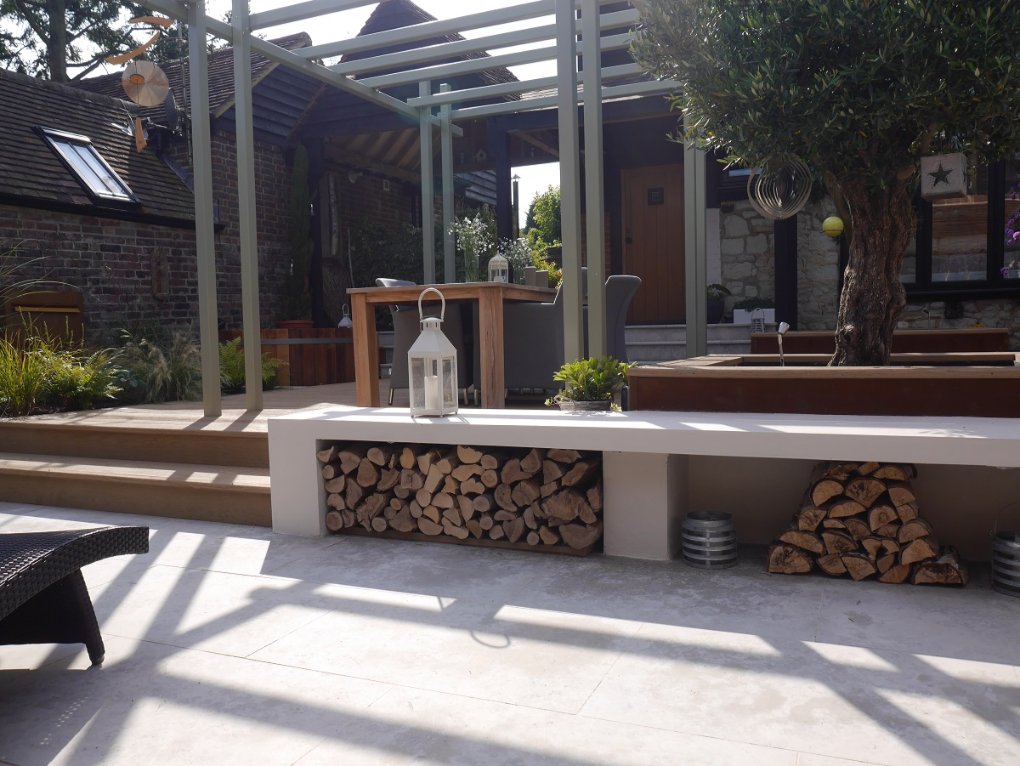 Jura Grey limestone paving with steps up to Millboard deckin