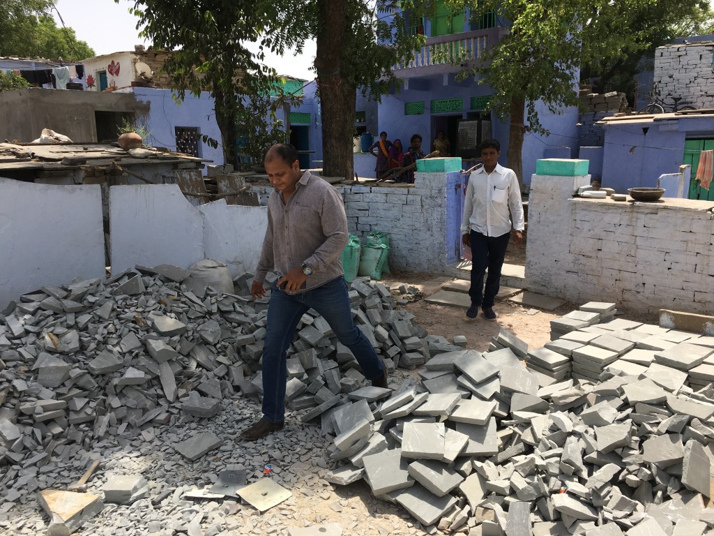 Waste stone is dropped off at houses to be worked into cobbles by families