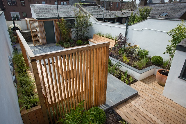 View across garden over larch screen